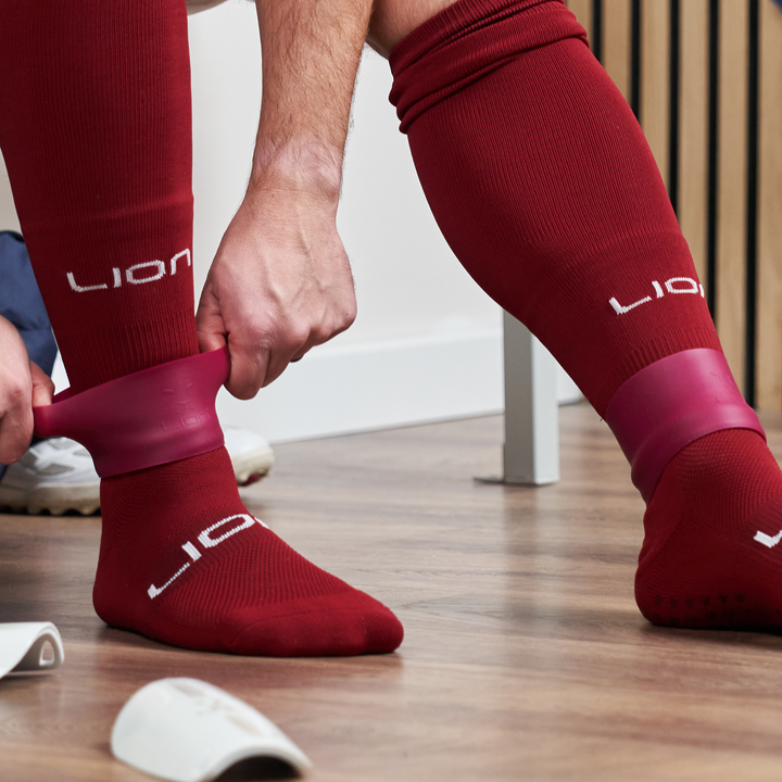 Burgundy football sock band leg 