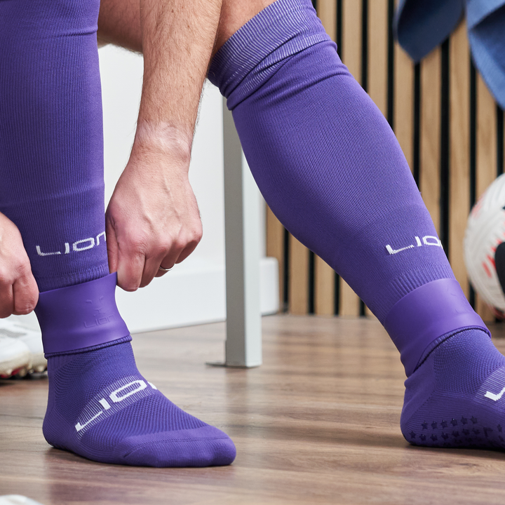Purple silicone holder for shin pad