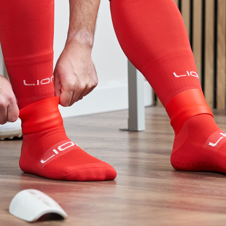 Red silicone holder for shin pad
