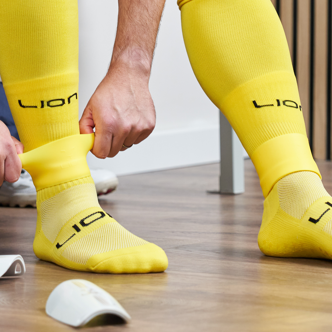 Yellow silicone holder for shin pad
